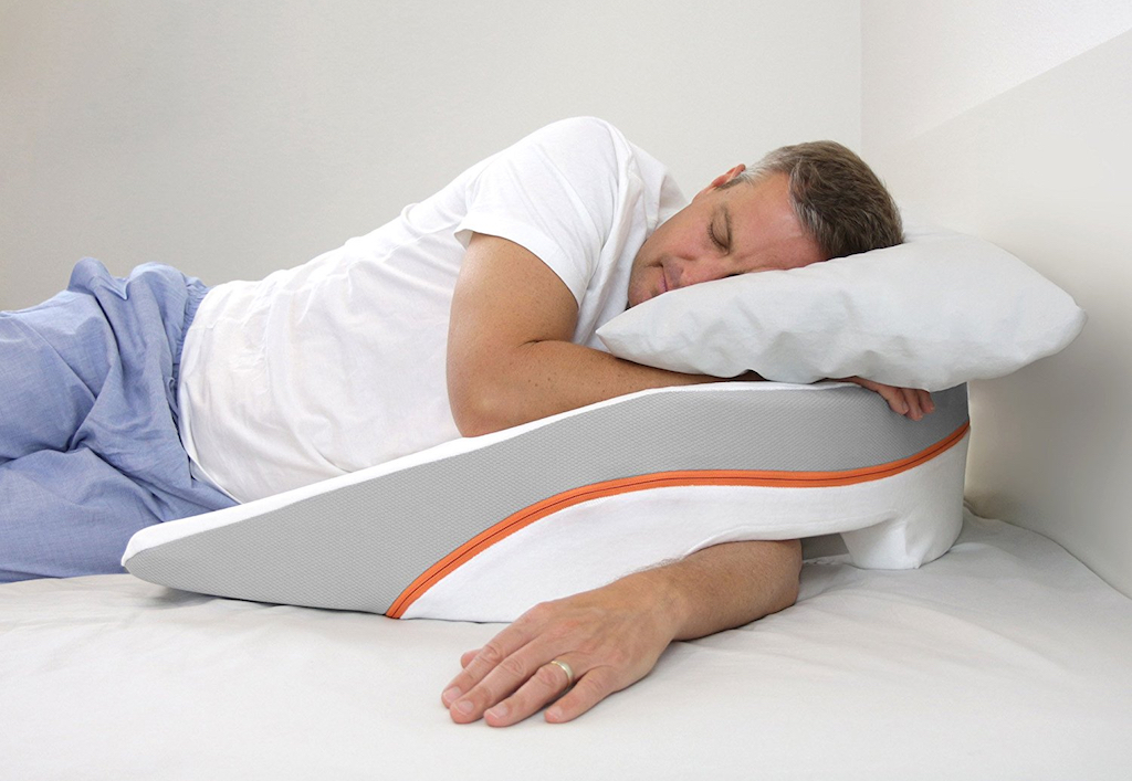Man sleeping on a special pillow for shoulder pain 