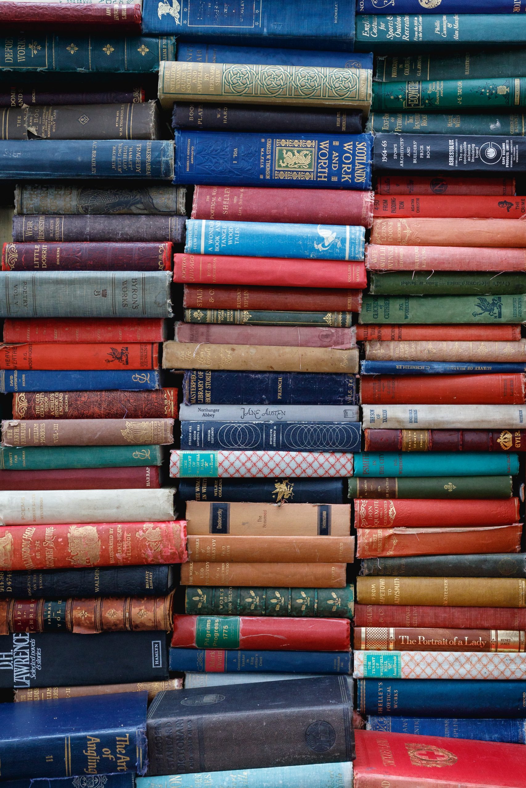 Big stacks of colorful hard cover books